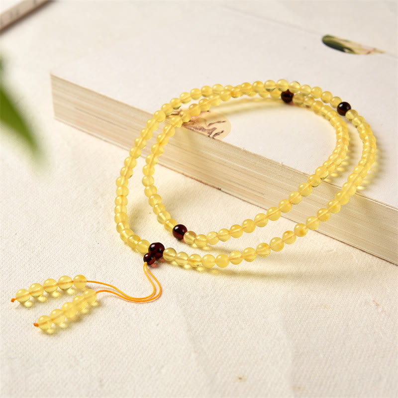 Braccialetto anti-ansia con 108 perline di mala in ambra naturale e trasparente Buddha Stones