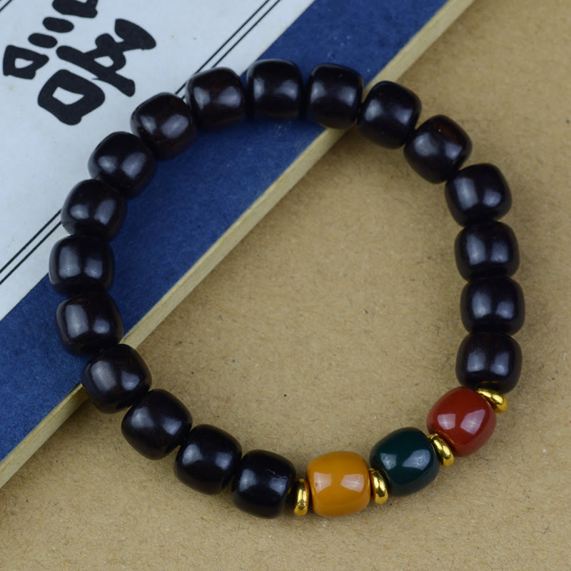 Braccialetto della pace in legno di sandalo rosso e legno di ebano Buddha Stones multicolore