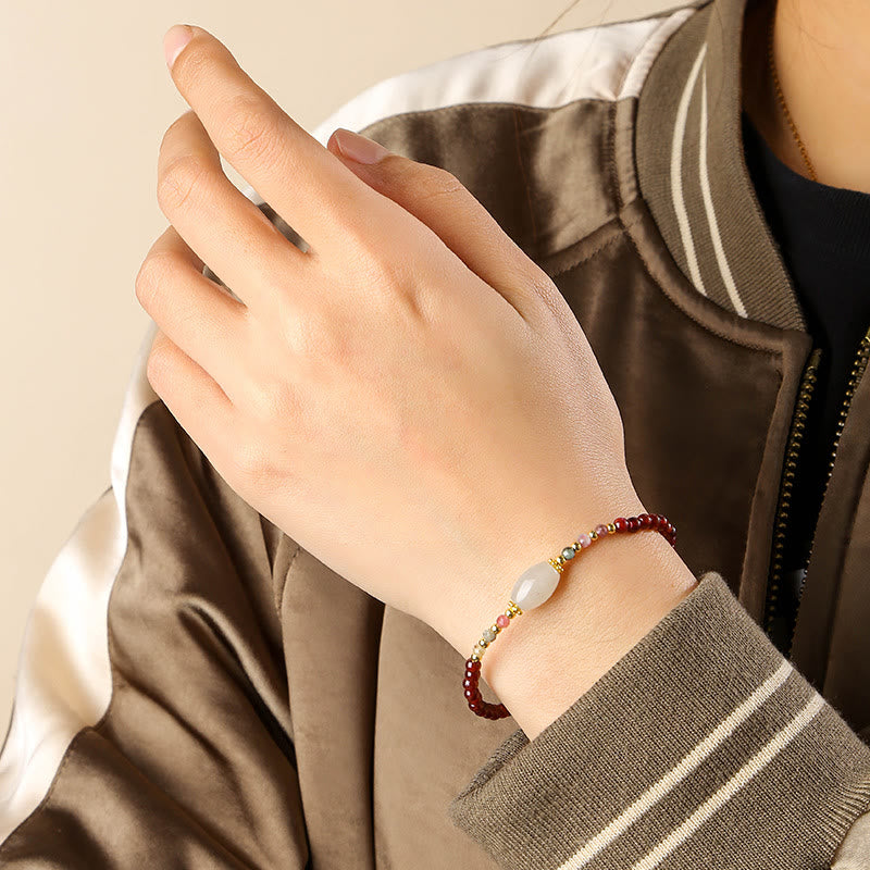 Bracciale Buddha Stones con perline di giada, tormalina e granato