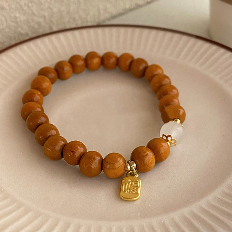 Braccialetto di protezione con ciondolo a forma di carattere Fu con occhio di gatto Buddha Stones in legno di sandalo