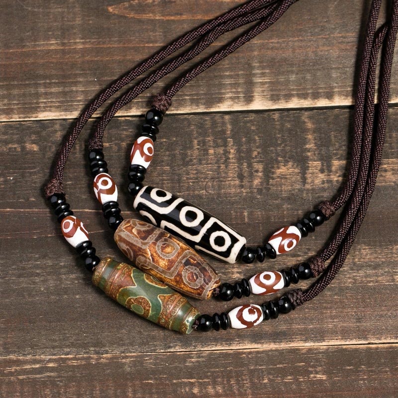 Buddha Stones Collana di perline tibetane Dzi a nove occhi con cordino protettivo - image 0