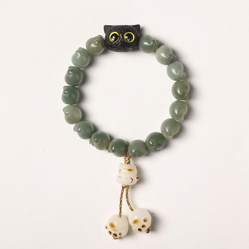 Buddha Stones Semi di Bodhi naturali Zampa adorabile Braccialetto di saggezza del gatto fortunato in legno di ebano - Seme di Bodhi verde - Versione con nappa (circonferenza del polso 14-15 cm) - image 15