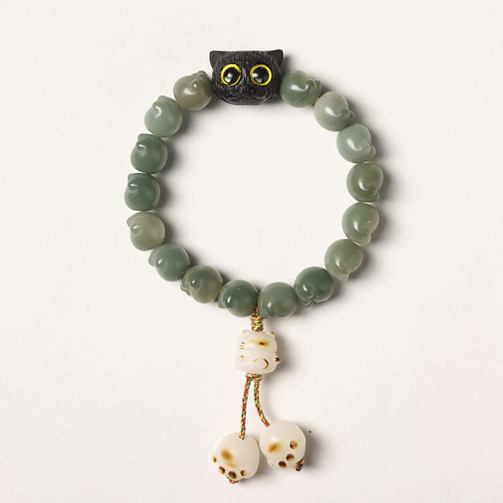 Buddha Stones Semi di Bodhi naturali Zampa adorabile Braccialetto di saggezza del gatto fortunato in legno di ebano - Seme di Bodhi verde - Versione con nappa (circonferenza del polso 14-15 cm) - image 15