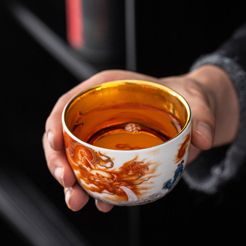 Buddha Stones Drago Fenice Gru Sole Oceano Onde Tazza da tè in ceramica dorata Tazza da tè Kung Fu 170ml