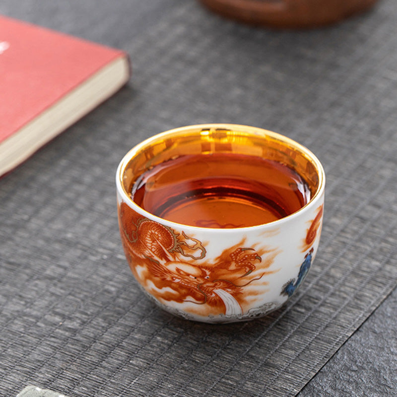 Buddha Stones Drago Fenice Gru Sole Oceano Onde Tazza da tè in ceramica dorata Tazza da tè Kung Fu 170ml