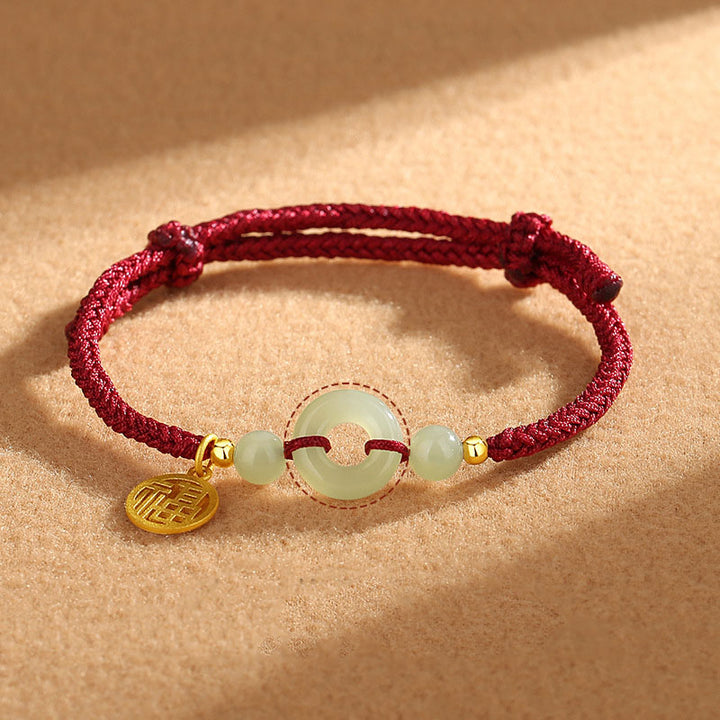 Braccialetto dell'abbondanza con ciondolo a forma di carattere Fu, fibbia della pace in argento sterling 925 con Buddha Stones e giada di Hetian - Corda rossa (circonferenza del polso 14-16 cm) - image 0