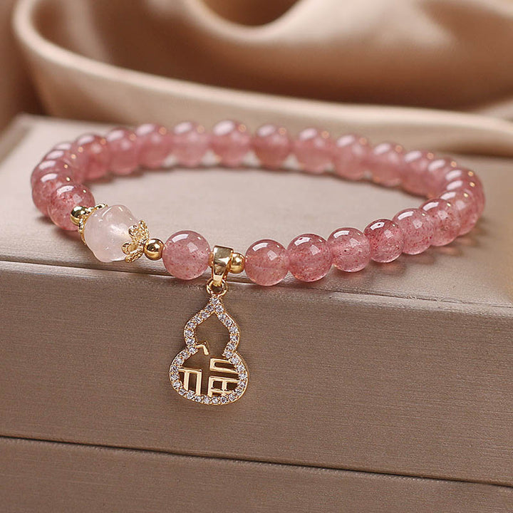 Braccialetto positivo con ciondolo a forma di carattere Fu di zucca e quarzo fragola Buddha Stones