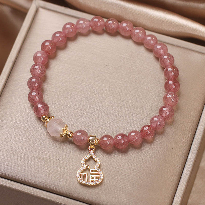 Braccialetto positivo con ciondolo a forma di carattere Fu di zucca e quarzo fragola Buddha Stones