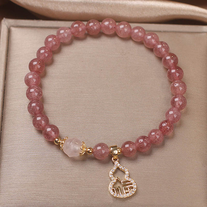 Braccialetto positivo con ciondolo a forma di carattere Fu di zucca e quarzo fragola Buddha Stones
