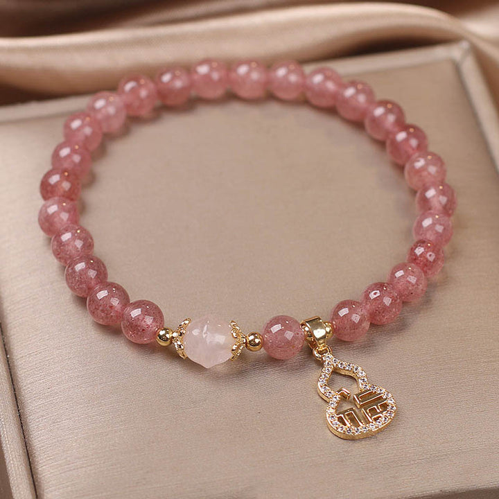 Braccialetto positivo con ciondolo a forma di carattere Fu di zucca e quarzo fragola Buddha Stones