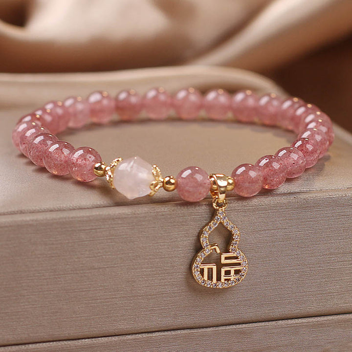 Braccialetto positivo con ciondolo a forma di carattere Fu di zucca e quarzo fragola Buddha Stones