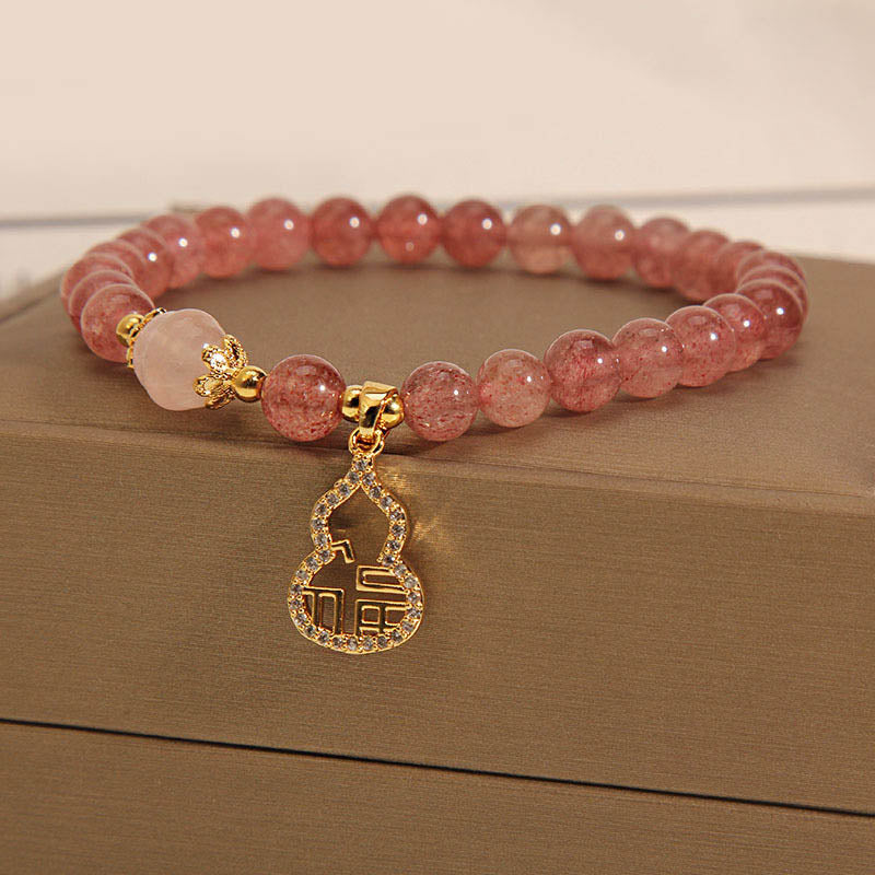 Braccialetto positivo con ciondolo a forma di carattere Fu di zucca e quarzo fragola Buddha Stones
