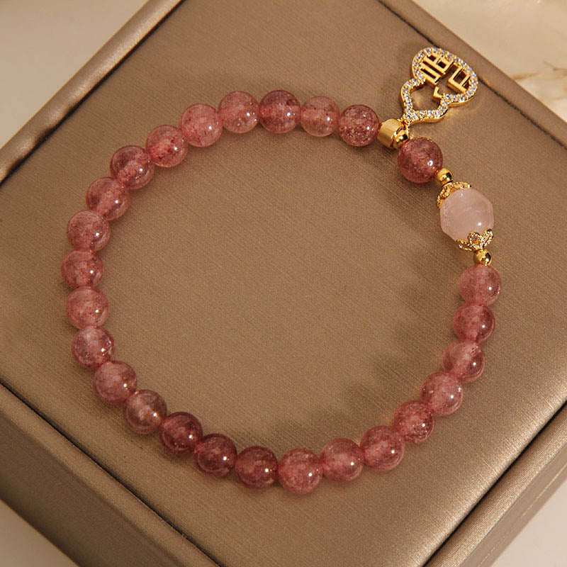 Braccialetto positivo con ciondolo a forma di carattere Fu di zucca e quarzo fragola Buddha Stones