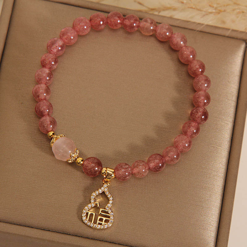 Braccialetto positivo con ciondolo a forma di carattere Fu di zucca e quarzo fragola Buddha Stones