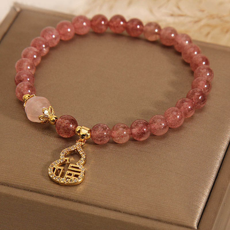 Braccialetto positivo con ciondolo a forma di carattere Fu di zucca e quarzo fragola Buddha Stones