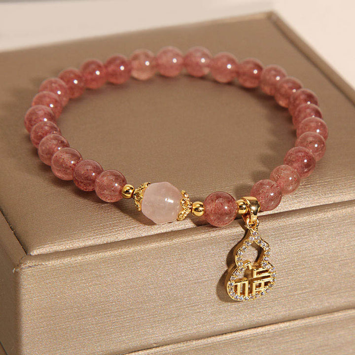 Braccialetto positivo con ciondolo a forma di carattere Fu di zucca e quarzo fragola Buddha Stones