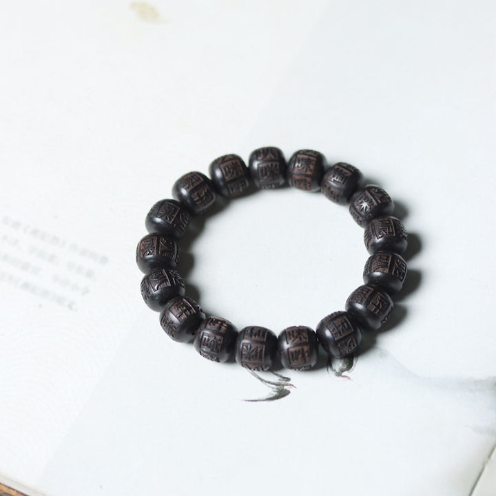 Braccialetto di equilibrio inciso in legno di Buddha Stones tibetano Om Mani Padme Hum