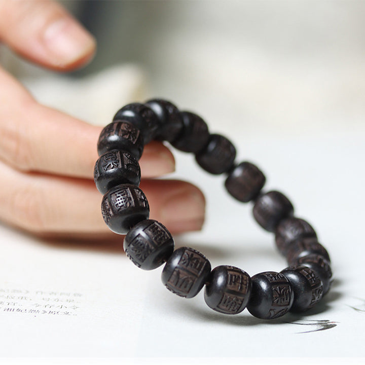 Braccialetto di equilibrio inciso in legno di Buddha Stones tibetano Om Mani Padme Hum
