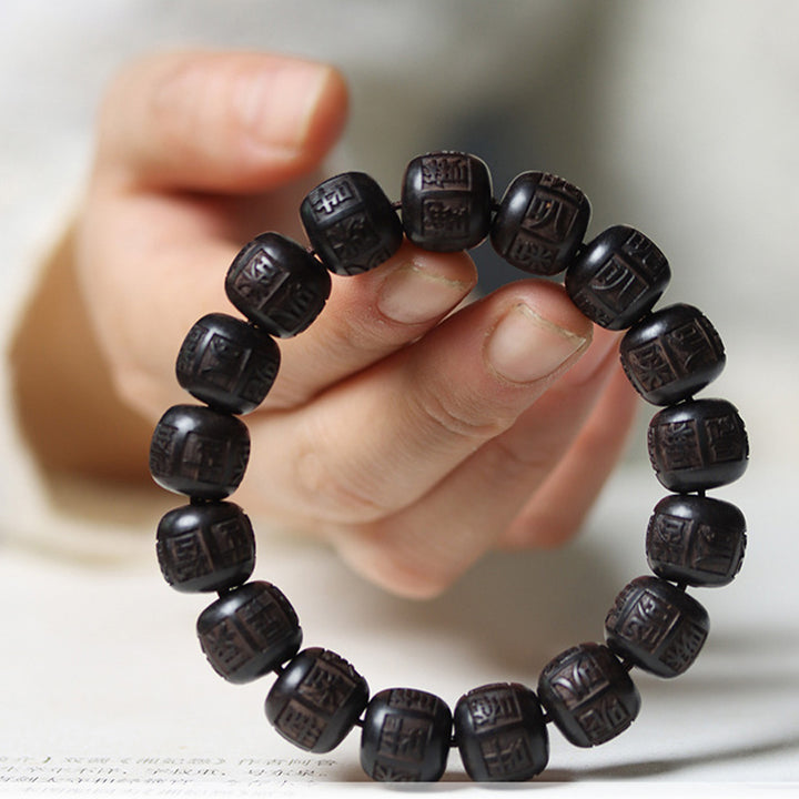 Braccialetto di equilibrio inciso in legno di Buddha Stones tibetano Om Mani Padme Hum