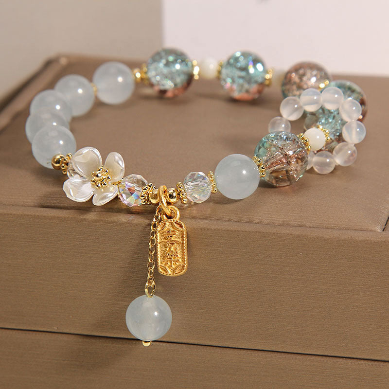 Braccialetto di guarigione naturale con fiore di calcedonio, ametista e cristallo blu Buddha Stones