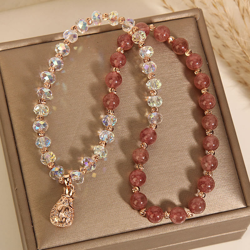 Braccialetto positivo con ciondolo a forma di borsa per soldi in cristallo bianco e quarzo fragola Buddha Stones