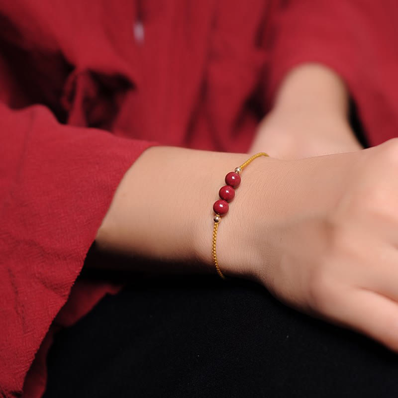 Bracciale intrecciato con corda di benedizione in cinabro naturale placcato oro 14K Buddha Stones