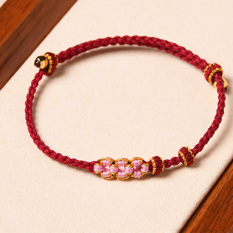Braccialetto di corda intrecciata con protezione in fiore di pesco fatto a mano Buddha Stones