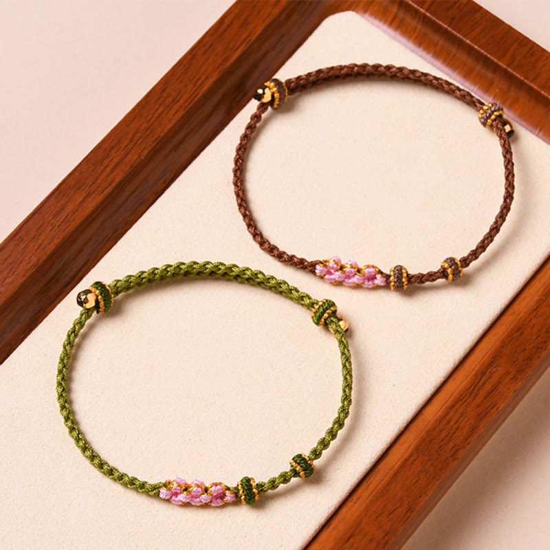 Braccialetto di corda intrecciata con protezione in fiore di pesco fatto a mano Buddha Stones