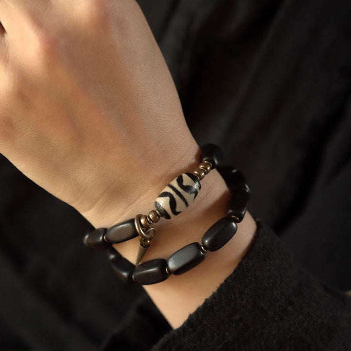 Braccialetto doppio giro in rame con perline di legno di Buddha Stones del Tibet Dzi