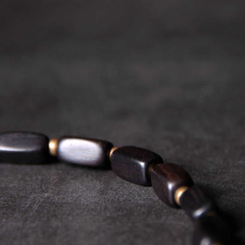 Braccialetto doppio giro in rame con perline di legno di Buddha Stones del Tibet Dzi