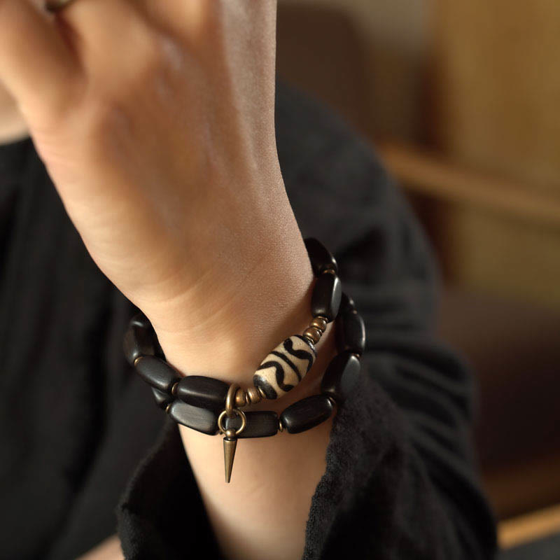 Braccialetto doppio giro in rame con perline di legno di Buddha Stones del Tibet Dzi
