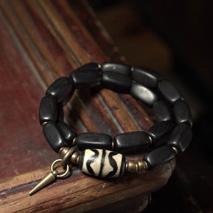 Braccialetto doppio giro in rame con perline di legno di Buddha Stones del Tibet Dzi