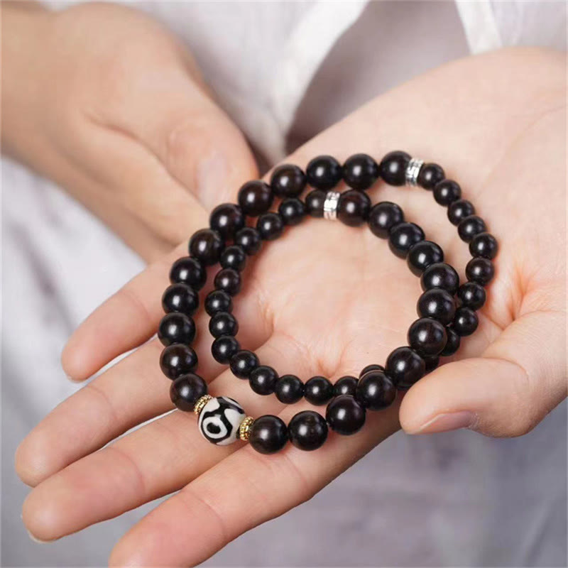 Braccialetto doppio giro in perline di legno di ebano del Tibet Dzi Buddha Stones