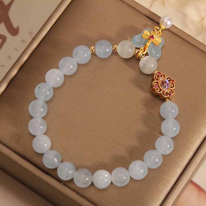 Braccialetto con ciondolo a forma di farfalla e perla con occhio di gatto e pietre Buddha Stones
