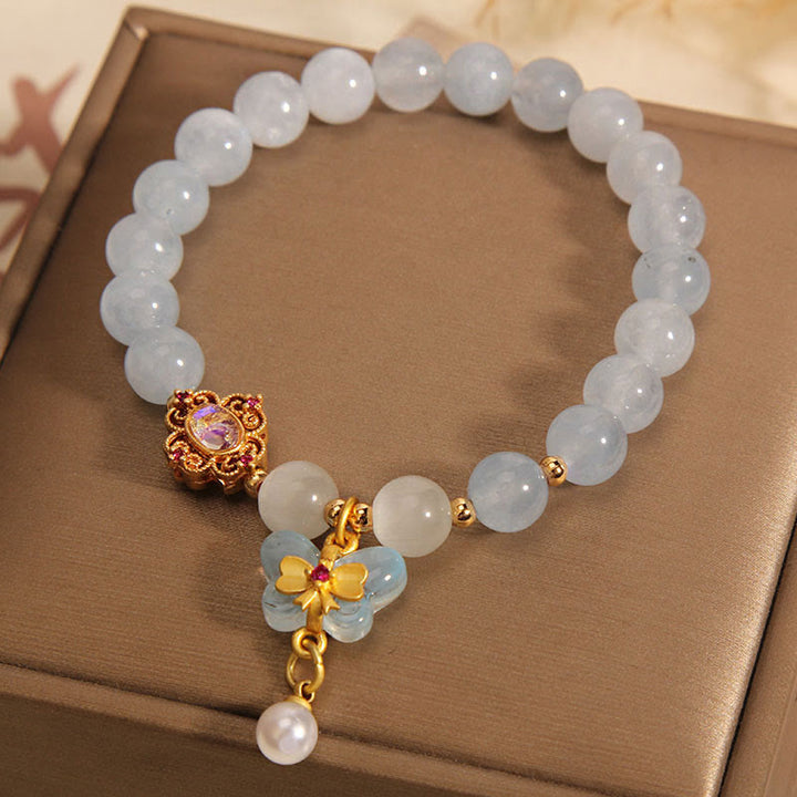 Braccialetto con ciondolo a forma di farfalla e perla con occhio di gatto e pietre Buddha Stones