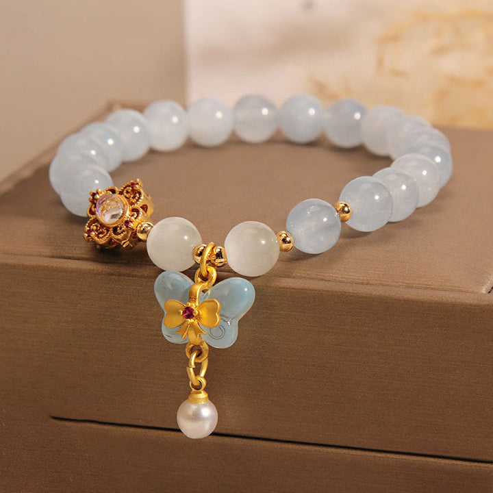 Braccialetto con ciondolo a forma di farfalla e perla con occhio di gatto e pietre Buddha Stones