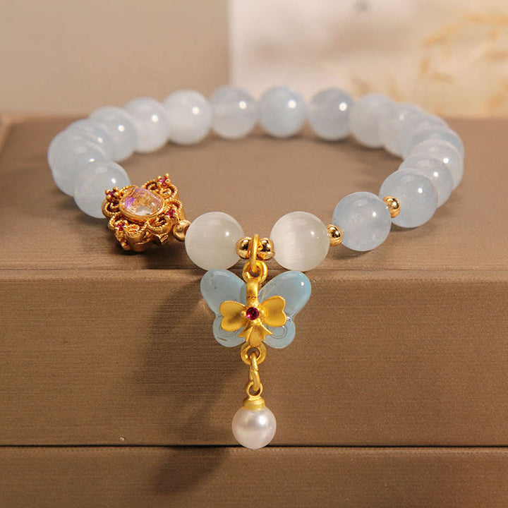 Braccialetto con ciondolo a forma di farfalla e perla con occhio di gatto e pietre Buddha Stones