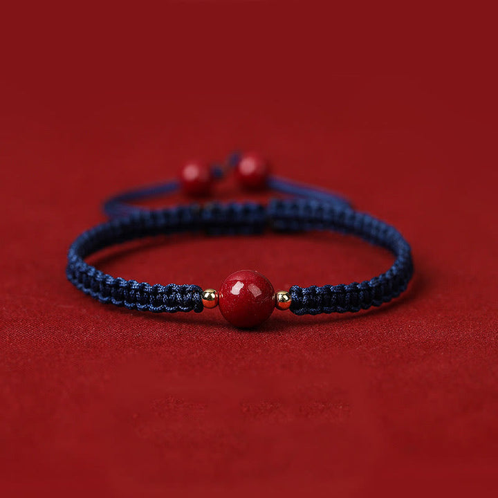 Braccialetto con cordino rosso e perline di cinabro fortunato Buddha Stones