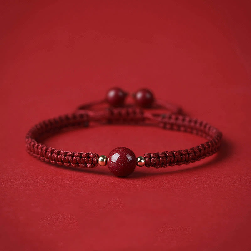 Braccialetto con cordino rosso e perline di cinabro fortunato Buddha Stones