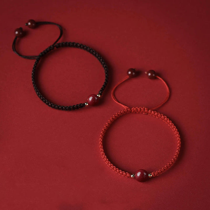 Braccialetto con cordino rosso e perline di cinabro fortunato Buddha Stones