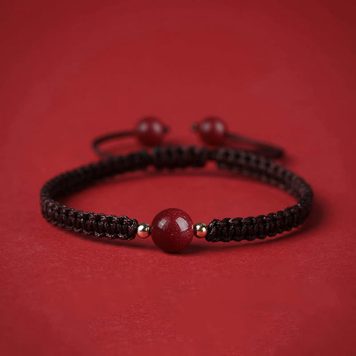 Braccialetto con cordino rosso e perline di cinabro fortunato Buddha Stones