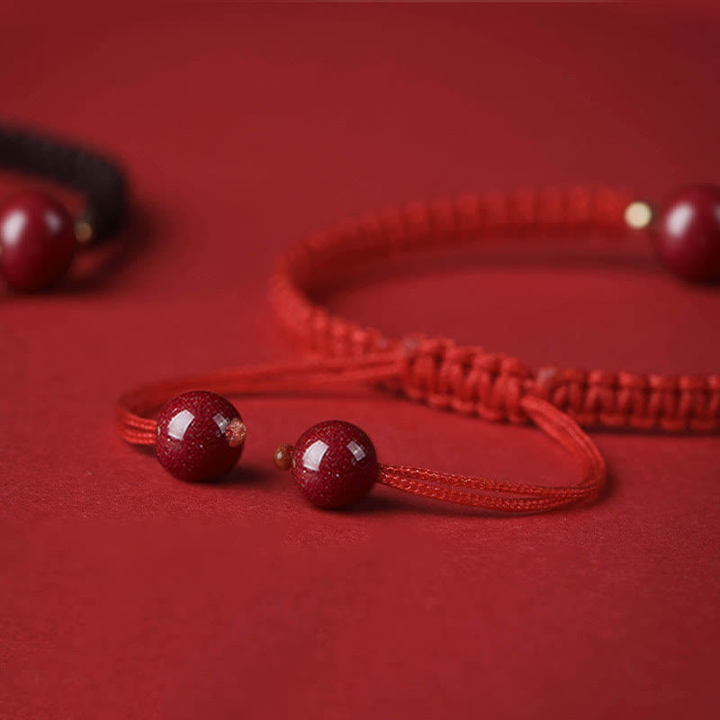 Braccialetto con cordino rosso e perline di cinabro fortunato Buddha Stones