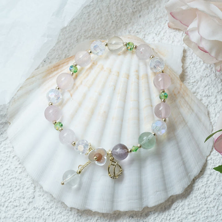 Braccialetto di guarigione con fiori di fluorite, quarzo fragola, quarzo rutilato Buddha Stones