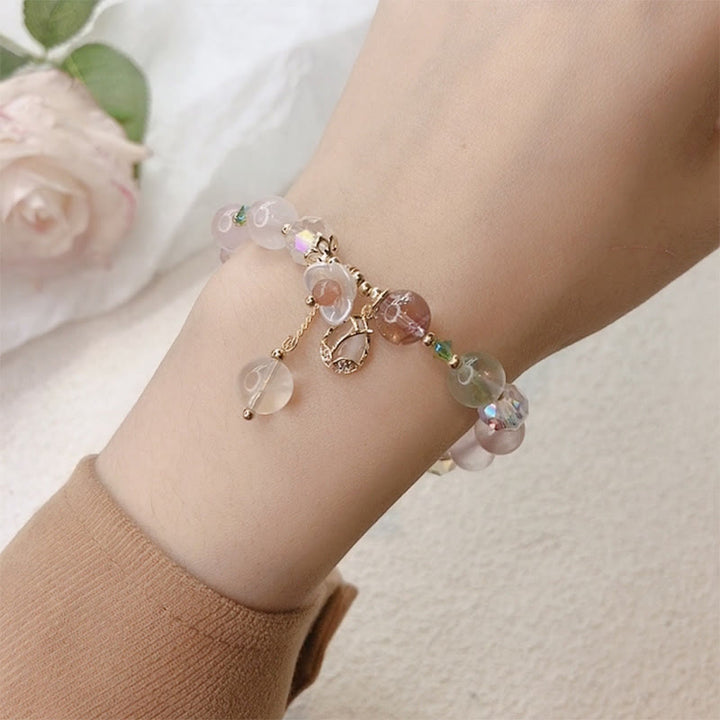 Braccialetto di guarigione con fiori di fluorite, quarzo fragola, quarzo rutilato Buddha Stones