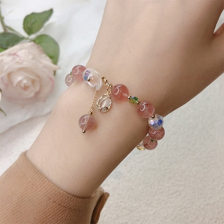 Braccialetto di guarigione con fiori di fluorite, quarzo fragola, quarzo rutilato Buddha Stones