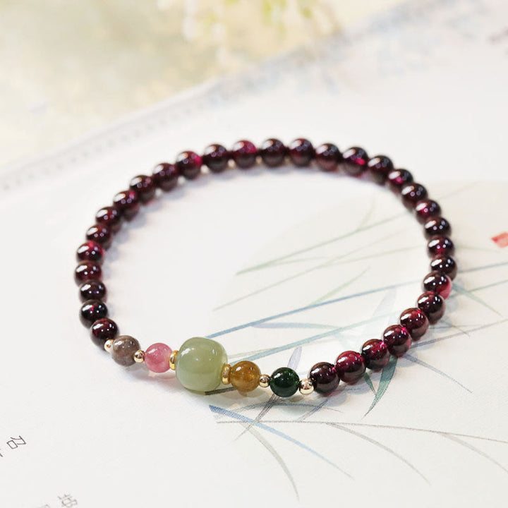 Braccialetto della passione con perline di giada e tormalina naturale di granato e Buddha Stones