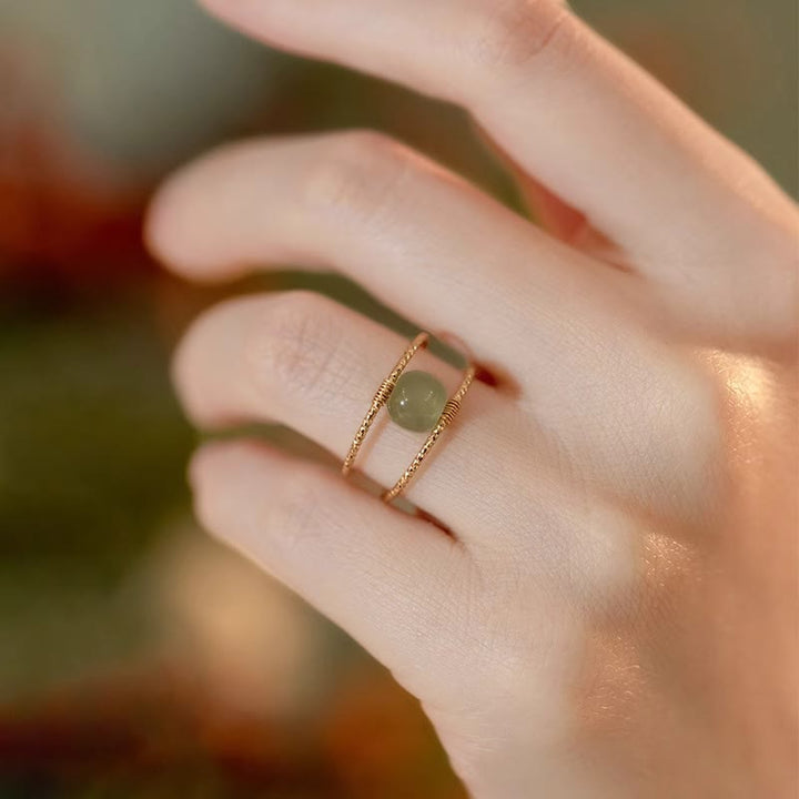 Anello regolabile con perle di giada rotonde in Buddha Stones e doppio strato di rame