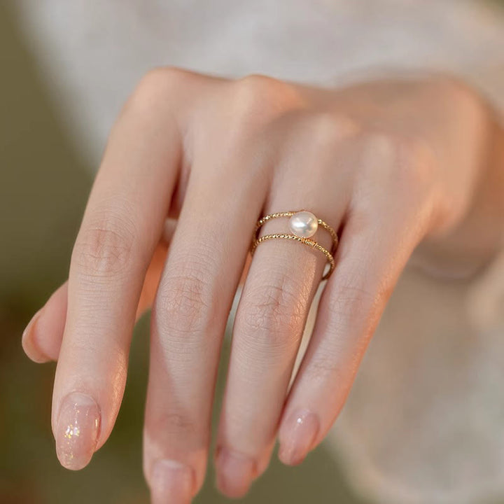 Anello regolabile con perle di giada rotonde in Buddha Stones e doppio strato di rame