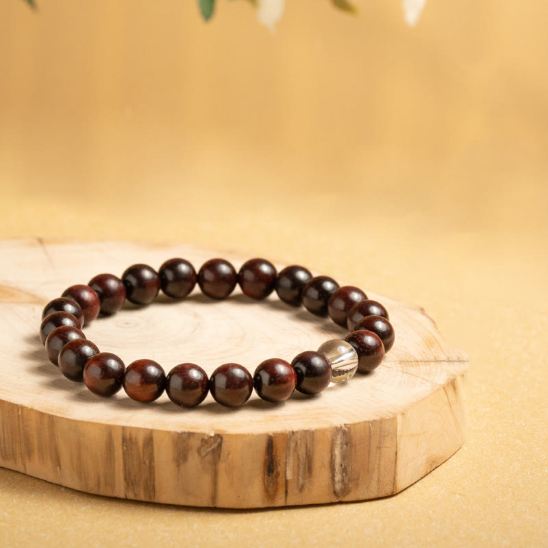 Braccialetto di protezione con piccole foglie di sandalo rosso e cristallo bianco Buddha Stones
