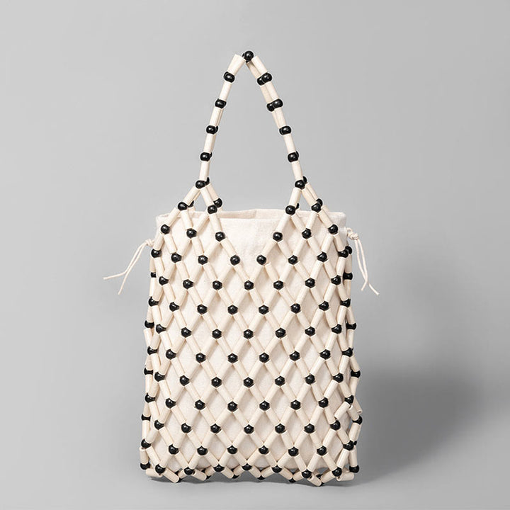 Borsa a mano con perline di legno cave intrecciate a mano in Buddha Stones
